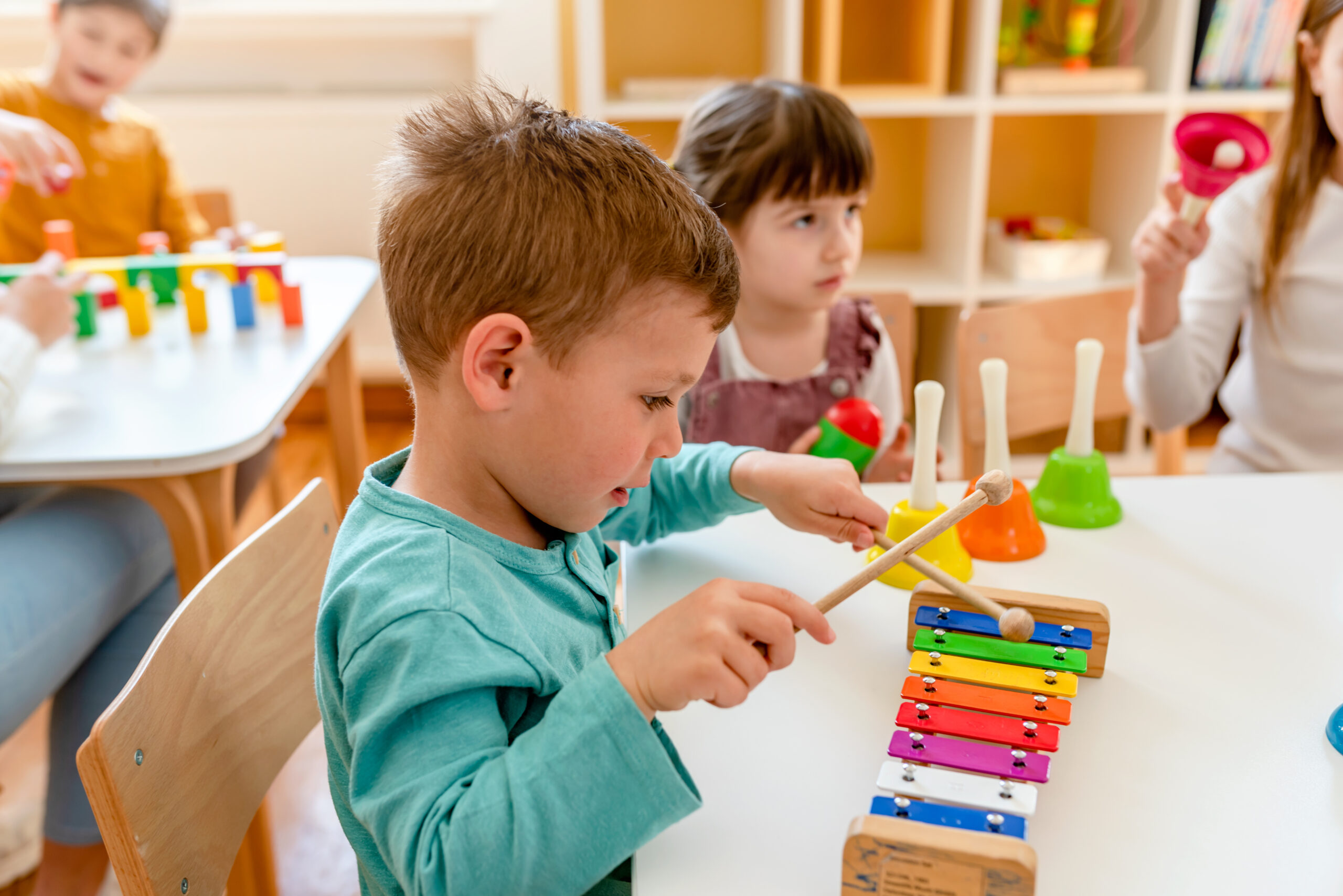 Kindergarten Children Learning Music Using Various Colorful Ins